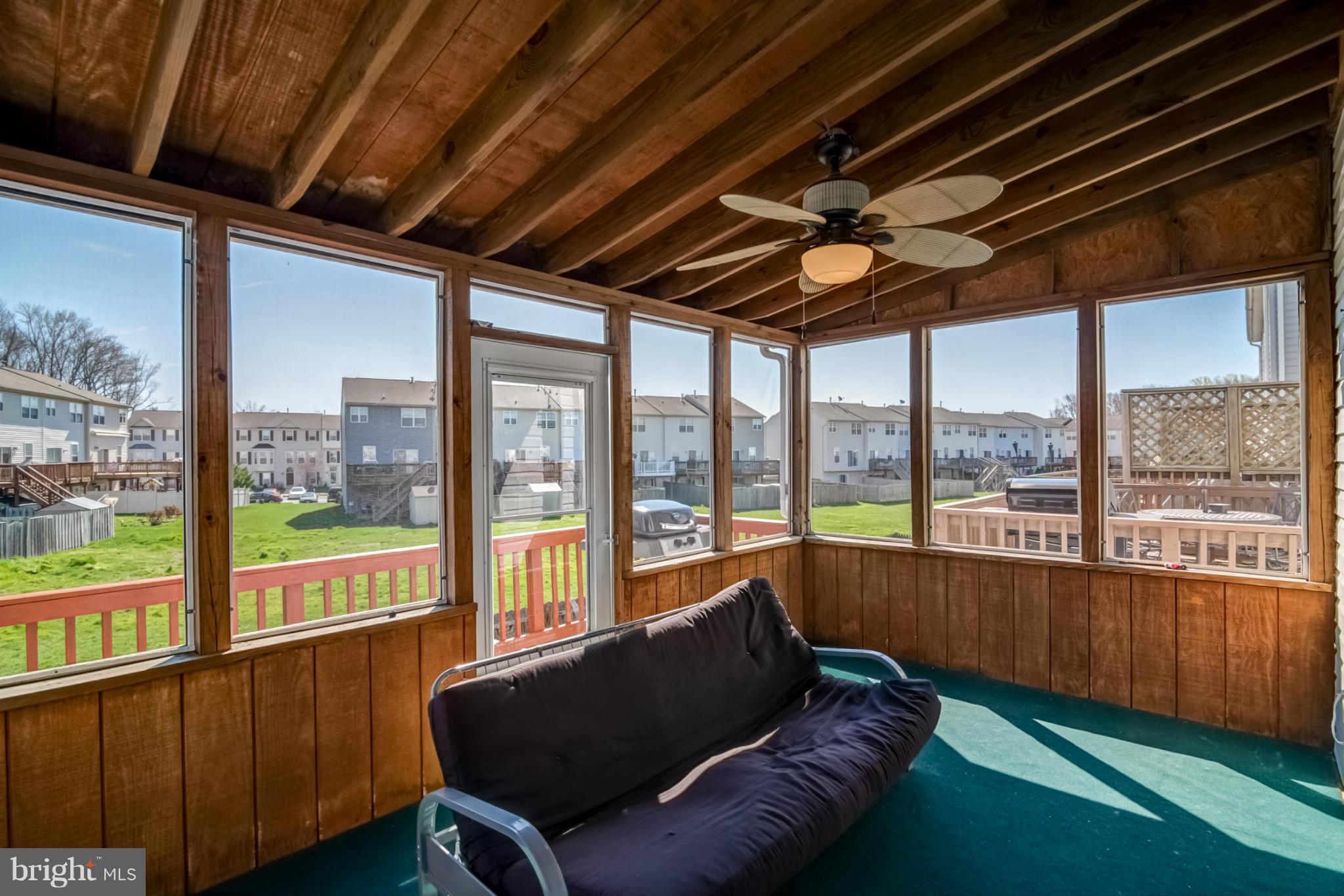 631 Hunting Fields Road Baltimore, MD 21220 - Photo 26 of 29 a living room with furniture and a floor to ceiling window