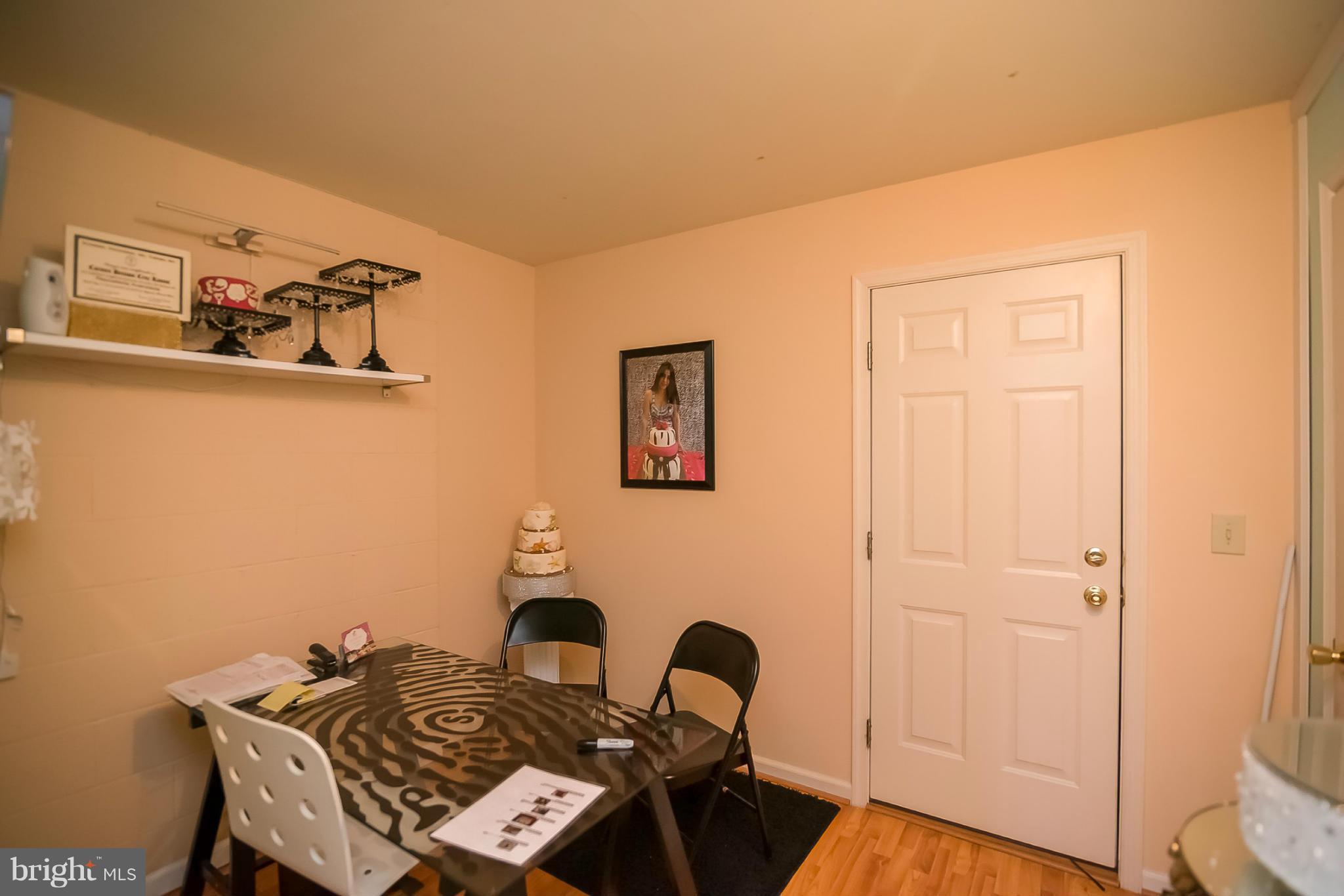 631 Hunting Fields Road Baltimore, MD 21220 - Photo 5 of 29 a view of a dining room with furniture and wooden floor