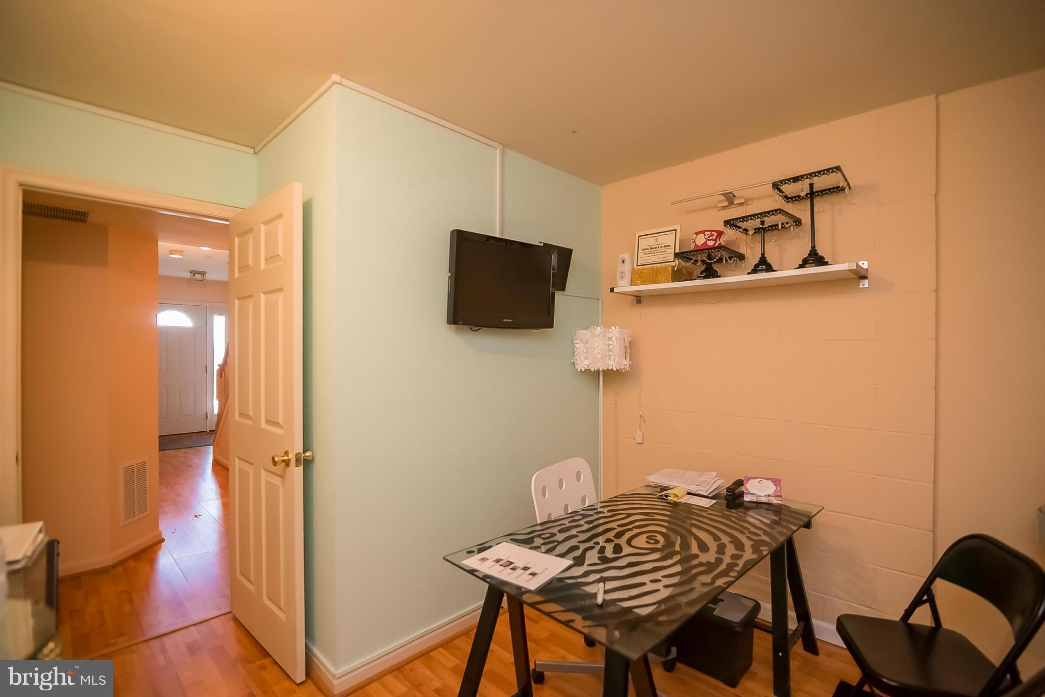 631 Hunting Fields Road Baltimore, MD 21220 - Photo 6 of 29 a view of a livingroom with furniture and a flat screen tv