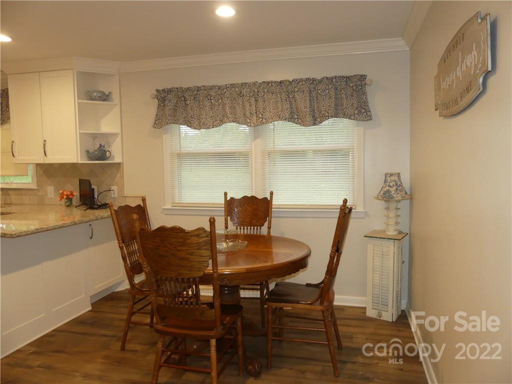 1319 Mooresboro Road Shelby, NC 28150 - Photo 12 of 27 a view of a dining room with furniture and wooden floor