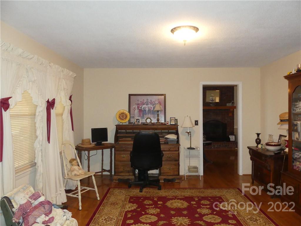 1319 Mooresboro Road Shelby, NC 28150 - Photo 16 of 27 a view of a hallway with workspace and living room