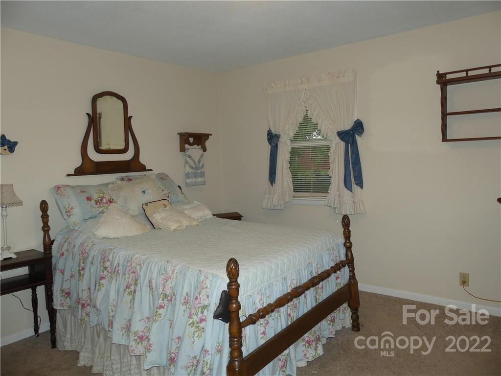 1319 Mooresboro Road Shelby, NC 28150 - Photo 20 of 27 a bedroom with a bed and dresser