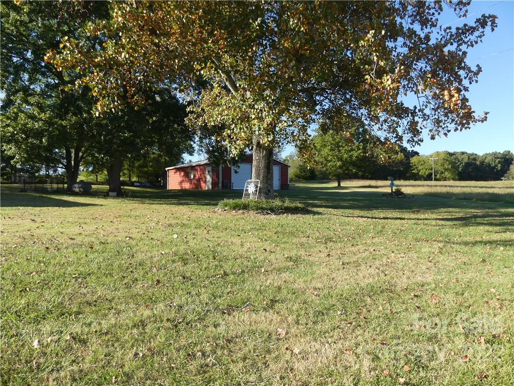 1319 Mooresboro Road Shelby, NC 28150 - Photo 2 of 27 a view of a trees in a yard