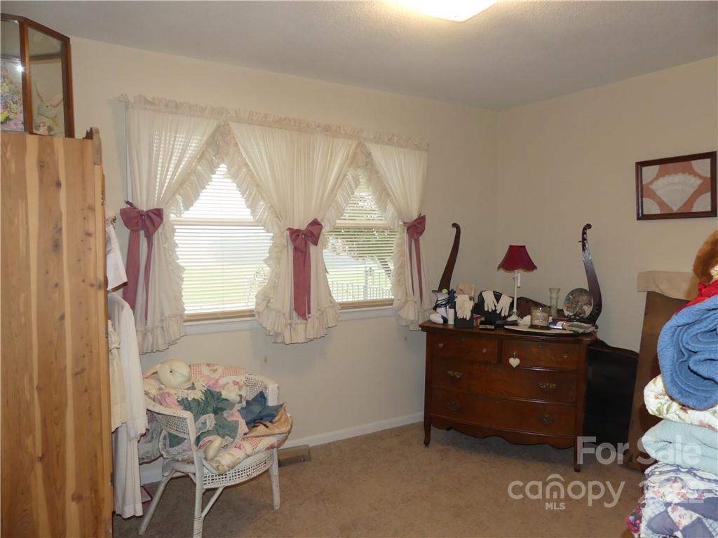 1319 Mooresboro Road Shelby, NC 28150 - Photo 22 of 27 a living room with furniture and a window