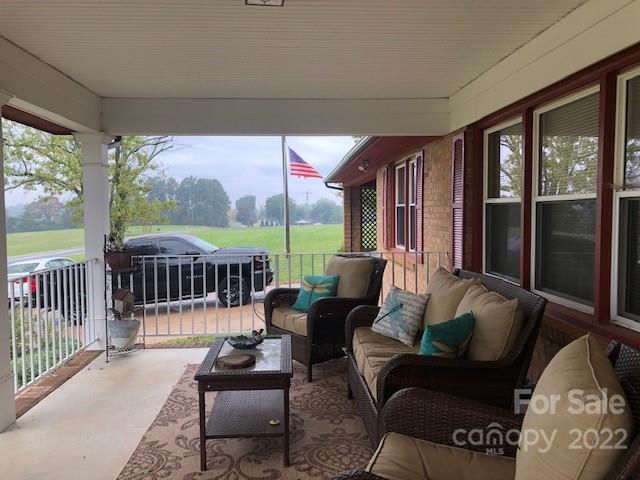 1319 Mooresboro Road Shelby, NC 28150 - Photo 3 of 27 a living room with furniture and a large window