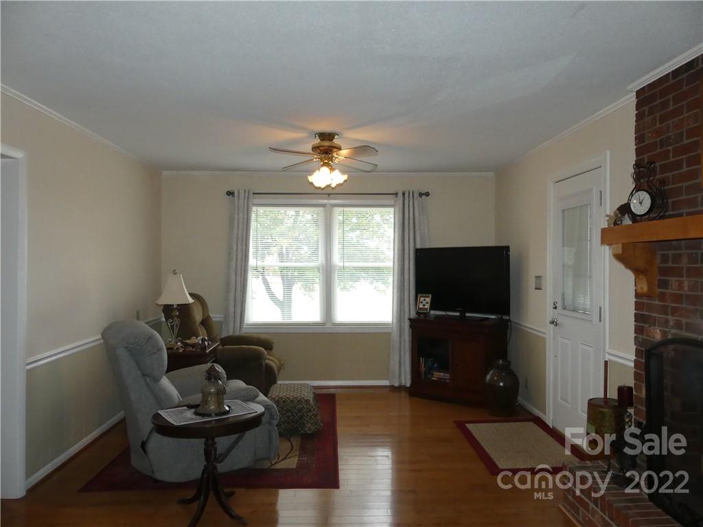 1319 Mooresboro Road Shelby, NC 28150 - Photo 7 of 27 a living room with furniture a window and a flat screen tv