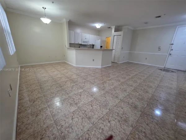 a view of a kitchen with a sink and cabinets