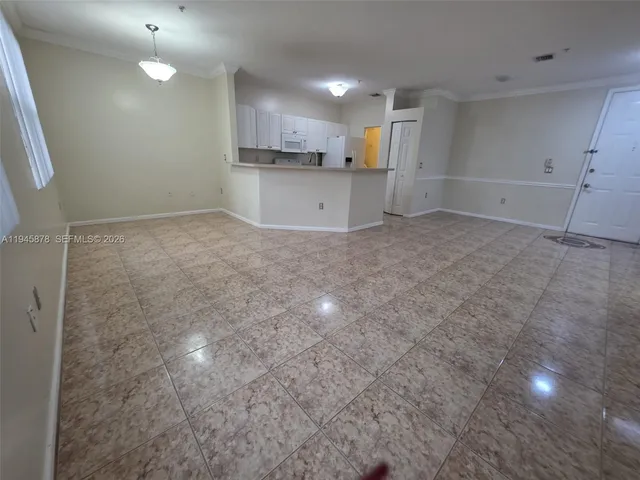 a view of a kitchen with a sink and cabinets