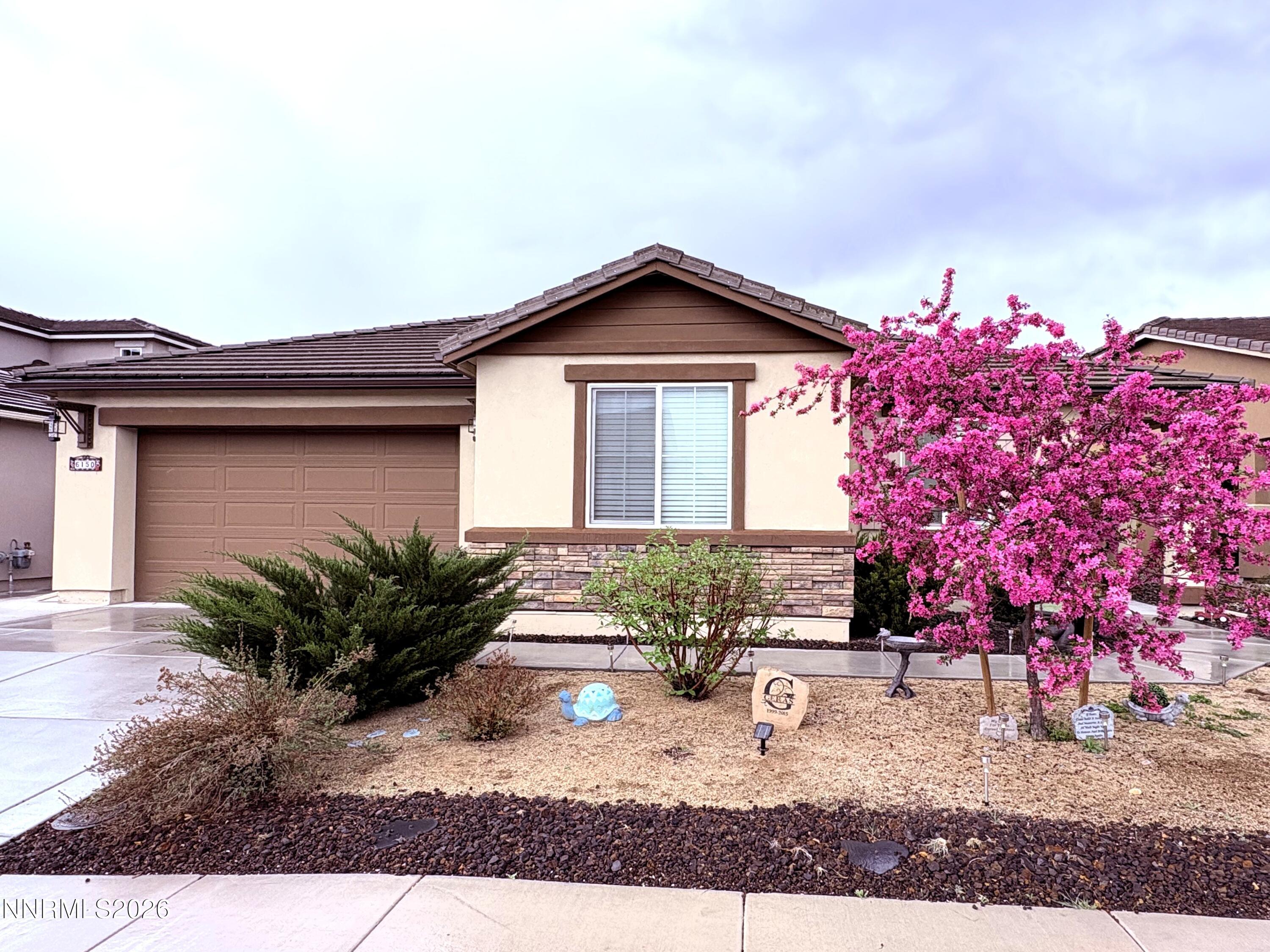 a front view of a house with garden