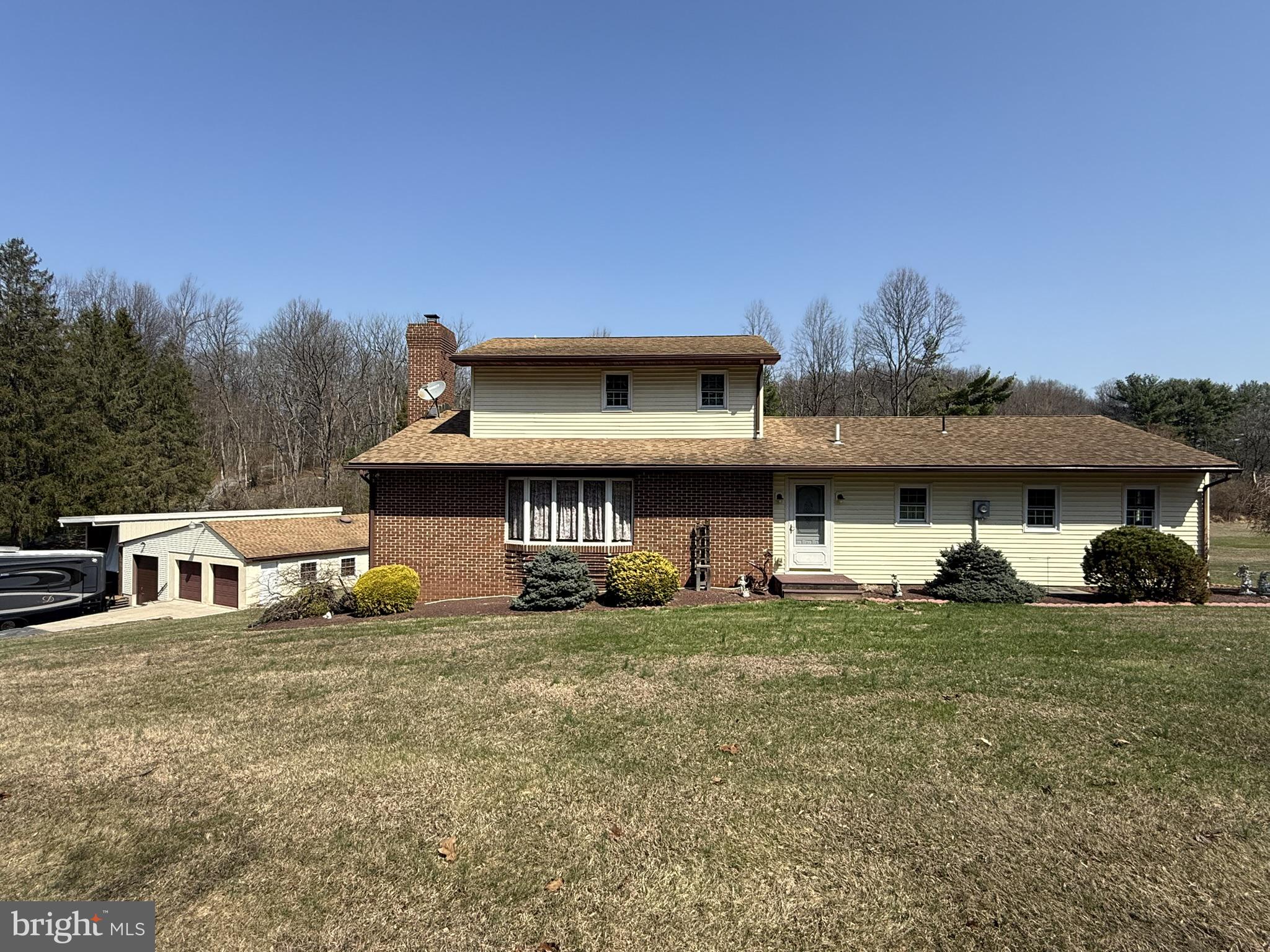 a view of a house with a yard