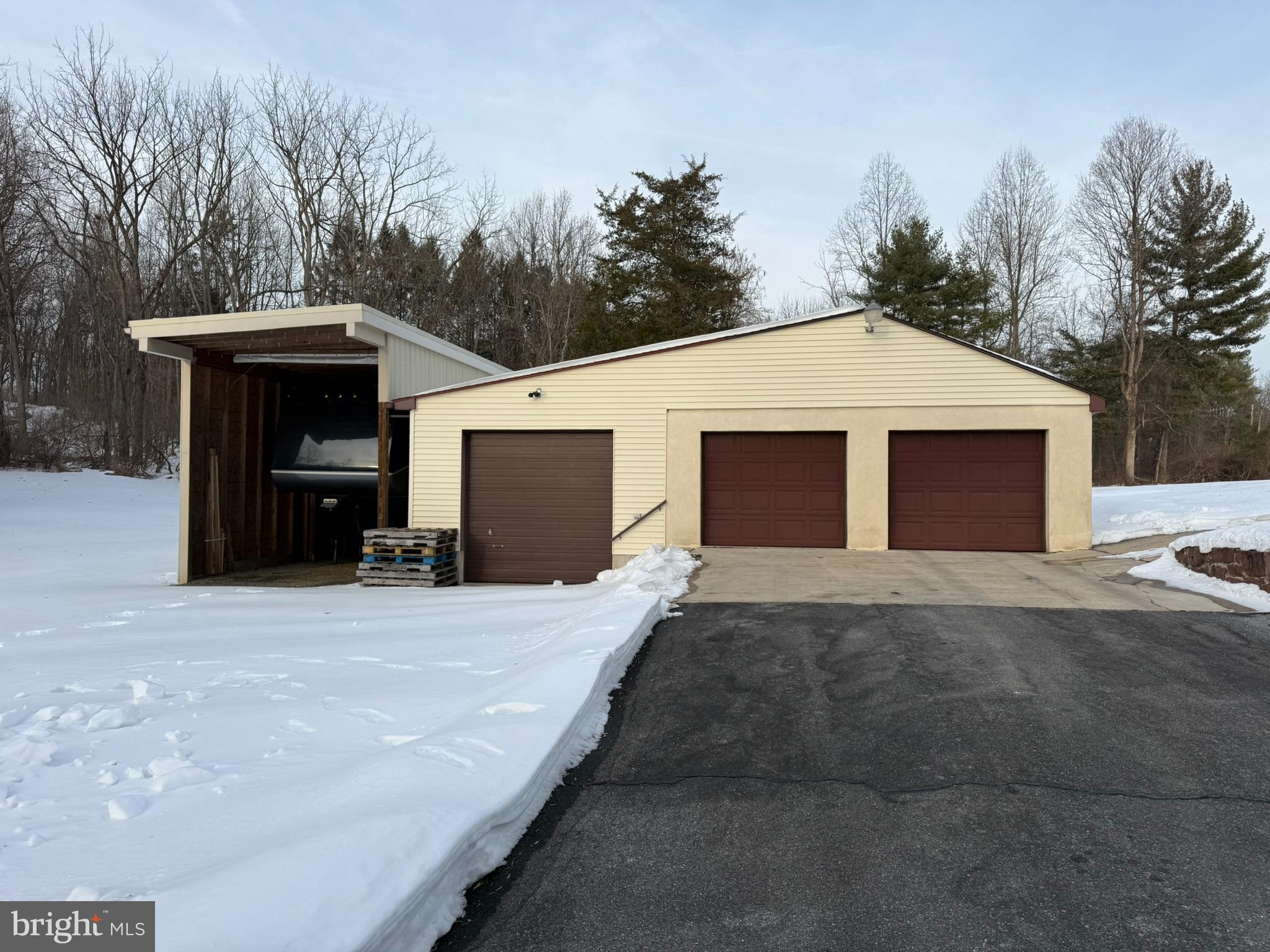 435 Westley Road Mohnton, PA 19540 - Photo 11 of 46 a front view of a house with a yard and garage