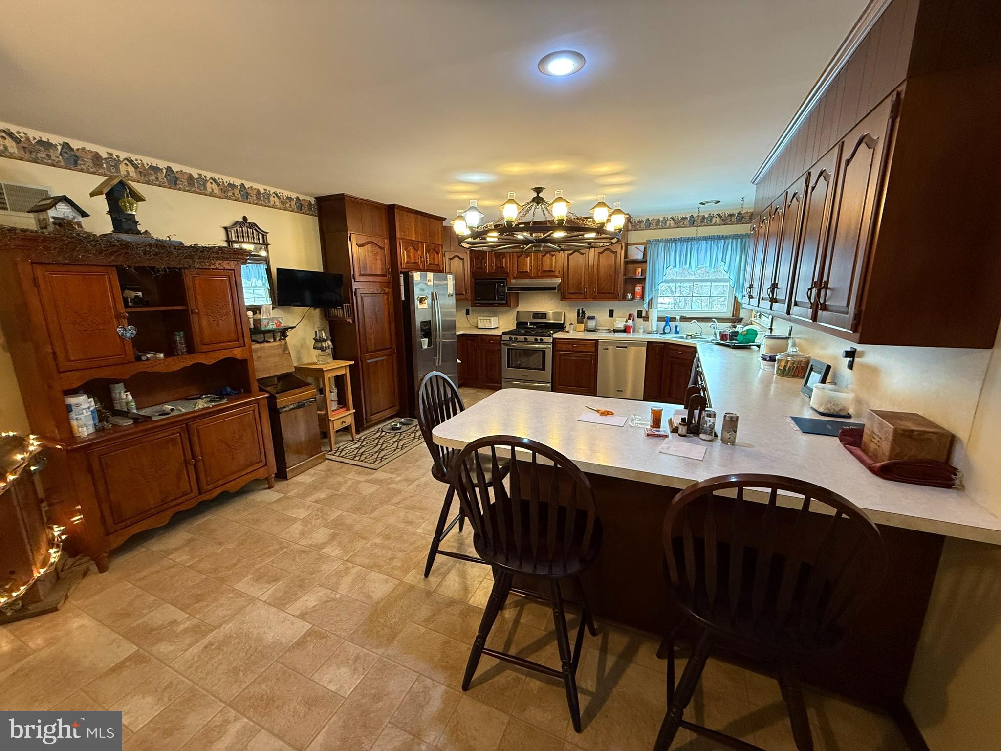 435 Westley Road Mohnton, PA 19540 - Photo 15 of 43 a kitchen with a dining table and chairs