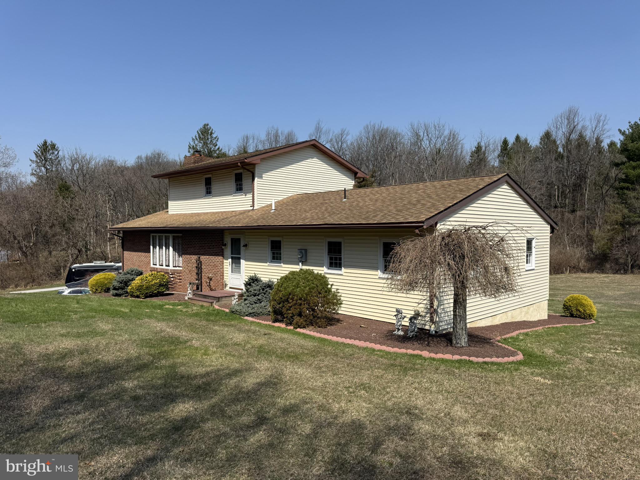 435 Westley Road Mohnton, PA 19540 - Photo 2 of 43 a view of a house with a yard and garage