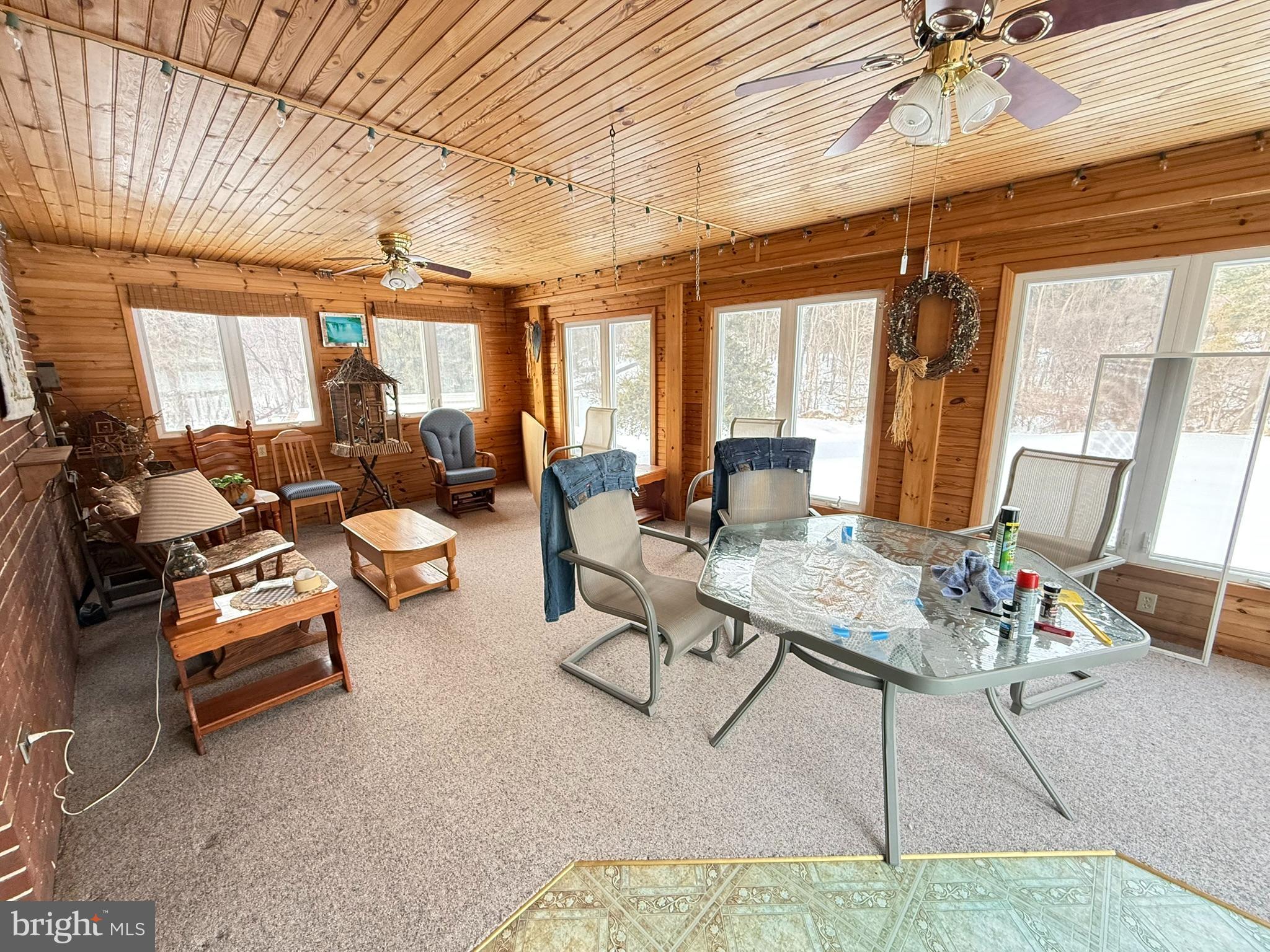435 Westley Road Mohnton, PA 19540 - Photo 24 of 43 a living room with furniture and a floor to ceiling window