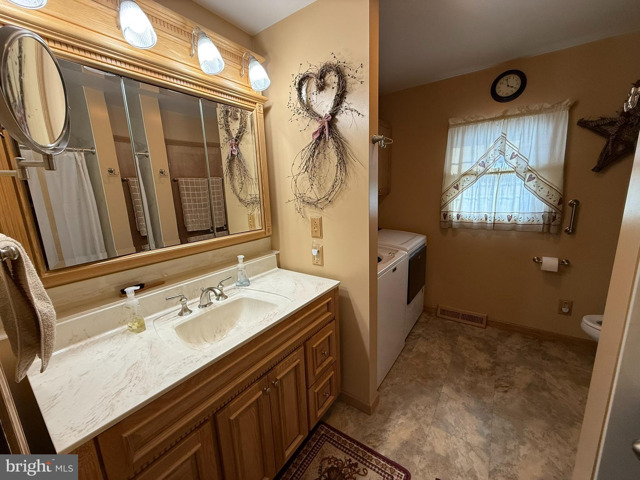 435 Westley Road Mohnton, PA 19540 - Photo 28 of 46 a bathroom with a sink a mirror and a shower