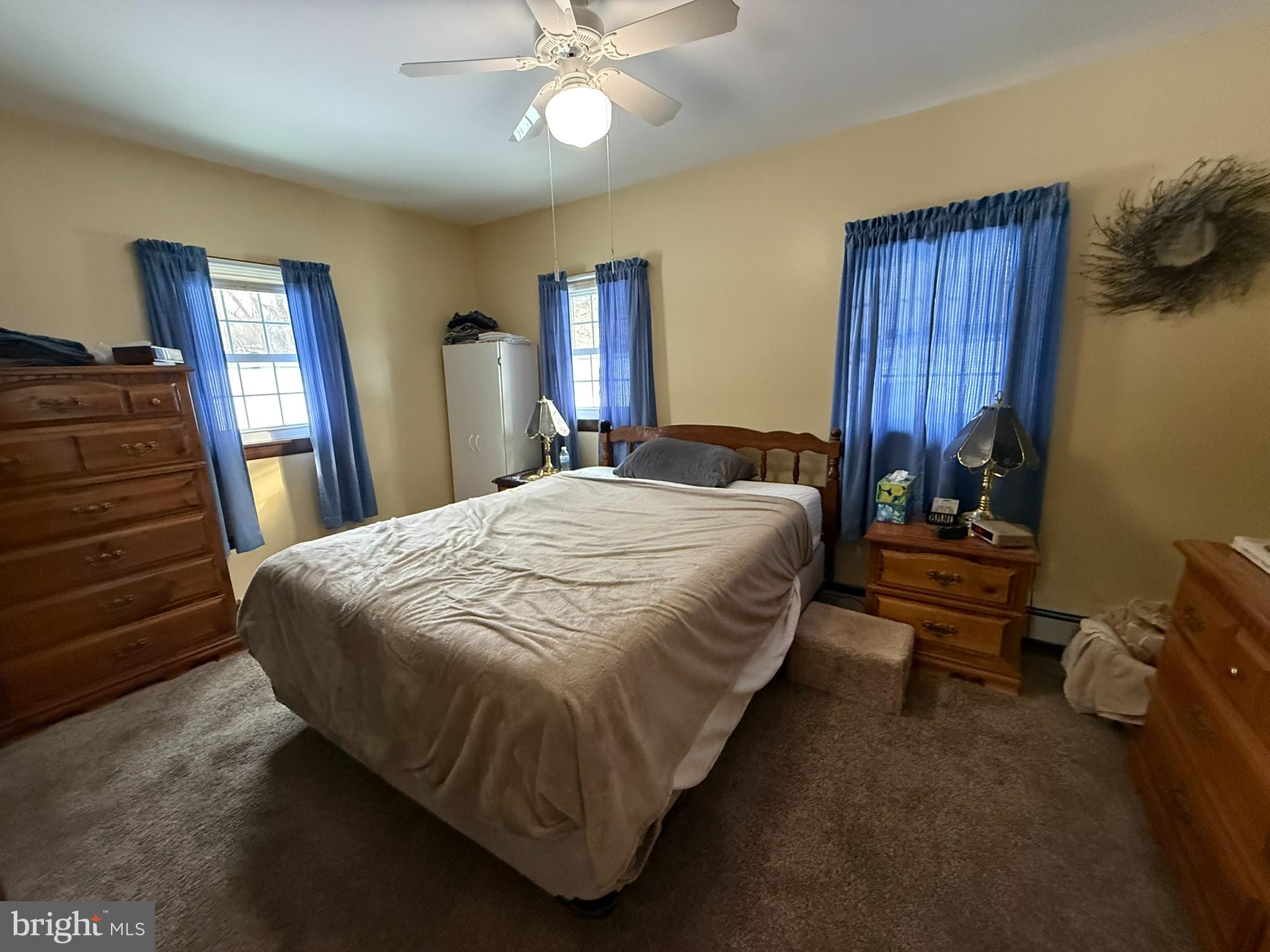 435 Westley Road Mohnton, PA 19540 - Photo 30 of 43 a bedroom with a bed and wooden floor