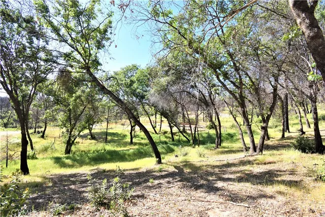 a swimming pool with outdoor seating and yard