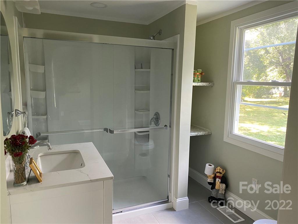 706 Kings Road Shelby, NC 28150 - Photo 11 of 25 a bathroom with a sink toilet and shower