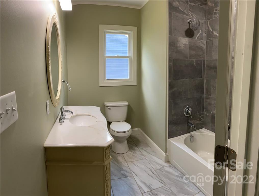 706 Kings Road Shelby, NC 28150 - Photo 14 of 25 a bathroom with a sink toilet and shower