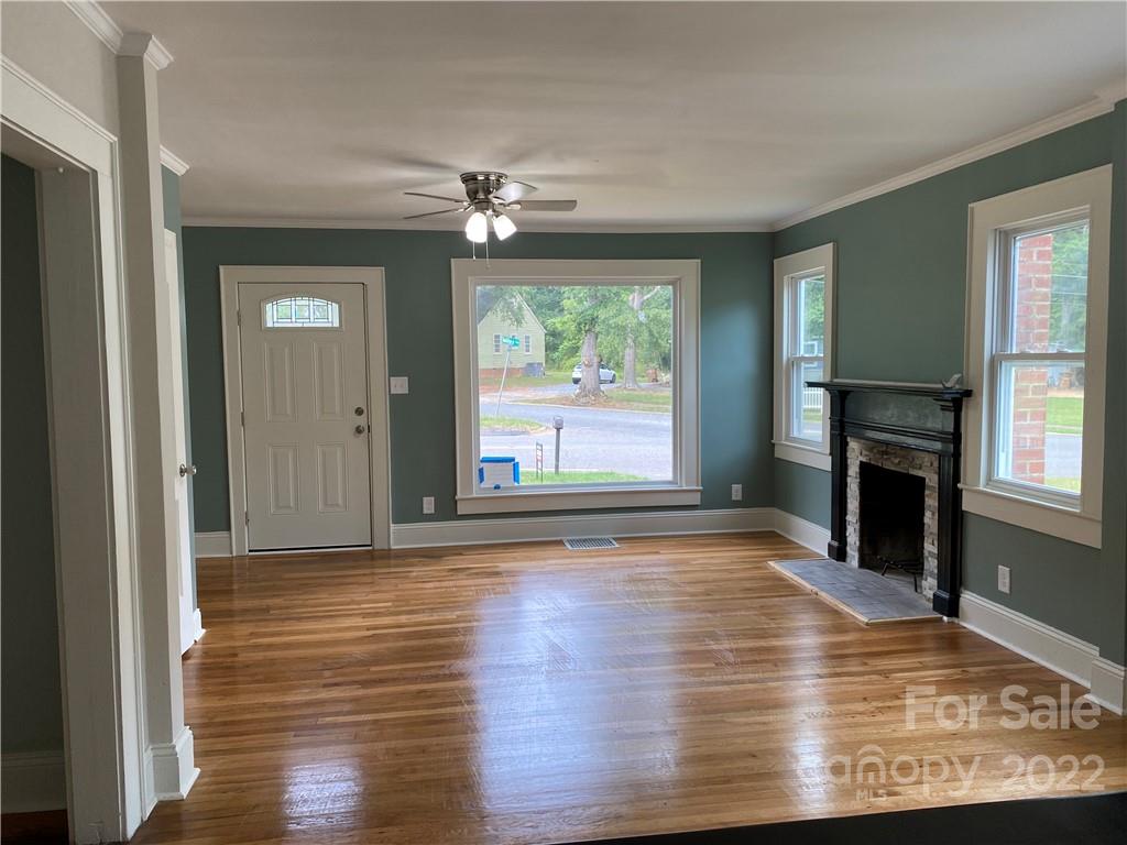 706 Kings Road Shelby, NC 28150 - Photo 5 of 25 a view of empty room with wooden floor and fan