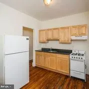 a white refrigerator freezer sitting inside of a kitchen