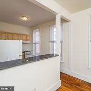 a kitchen with stainless steel appliances granite countertop a sink and a granite counter tops