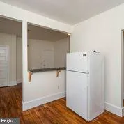a white refrigerator freezer sitting inside of a kitchen