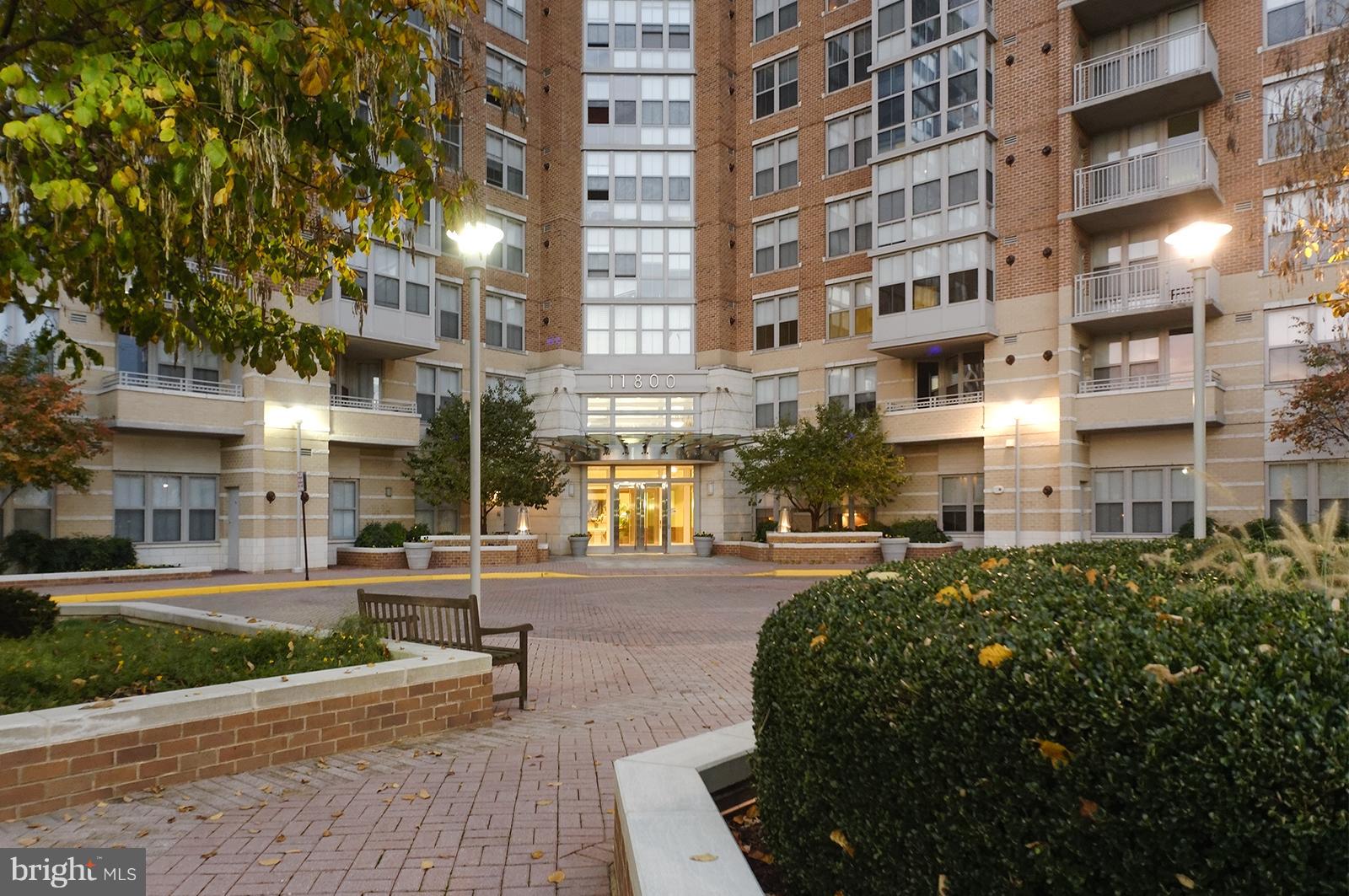 11800 Sunset Hills Road, Unit 210 Reston, VA 20190 - Photo 2 of 30 a view of a building with a garden