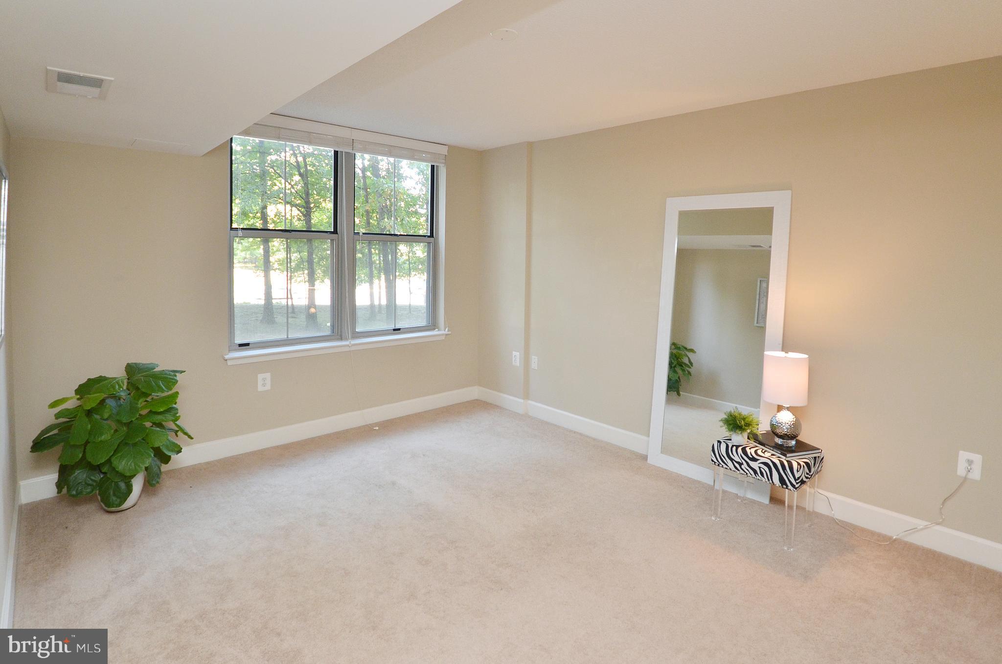 11800 Sunset Hills Road, Unit 210 Reston, VA 20190 - Photo 19 of 30 an empty room with a window