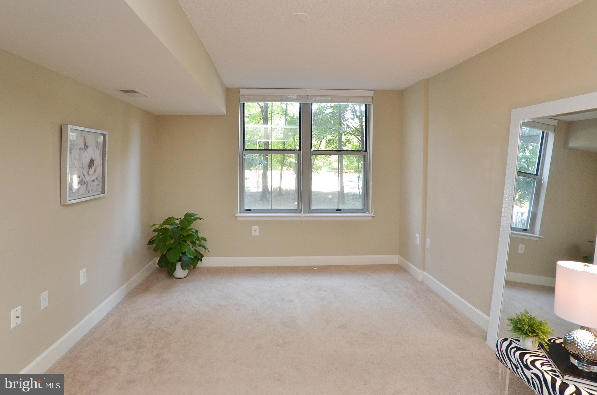 11800 Sunset Hills Road, Unit 210 Reston, VA 20190 - Photo 20 of 30 wooden floor in an empty room with a window