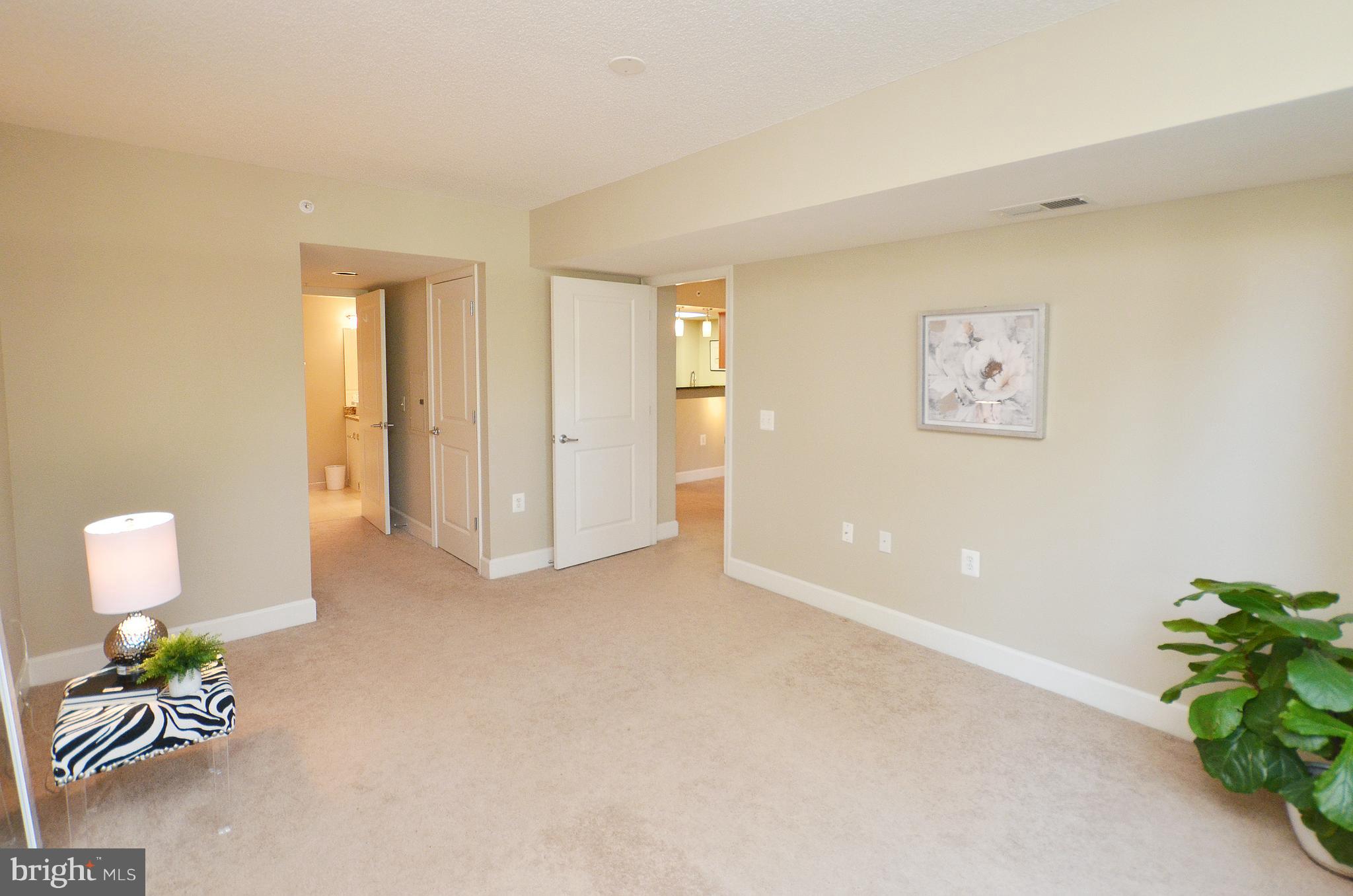 11800 Sunset Hills Road, Unit 210 Reston, VA 20190 - Photo 21 of 30 a view of an empty room with a window