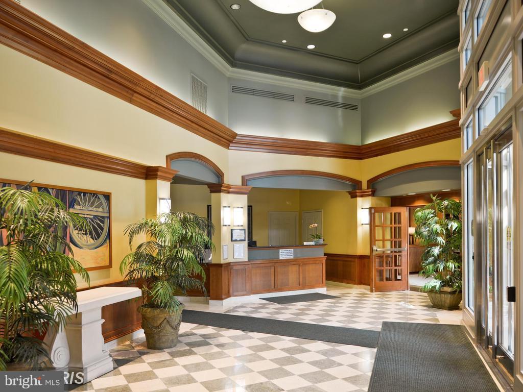 11800 Sunset Hills Road, Unit 210 Reston, VA 20190 - Photo 22 of 30 a lobby with furniture and potted plant