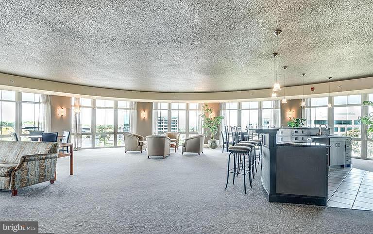 11800 Sunset Hills Road, Unit 210 Reston, VA 20190 - Photo 23 of 30 a room with lots of table and chairs