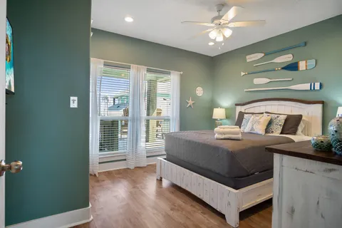 a living room with furniture and a dresser