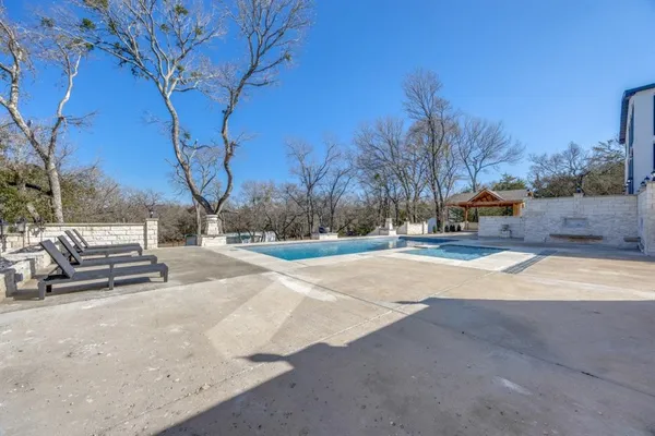 a view of outdoor space yard swimming pool and trees