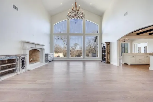 a view of living room with furniture and a fireplace
