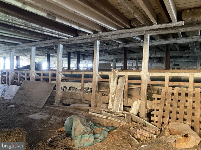 a view of walk in closet with wooden floor