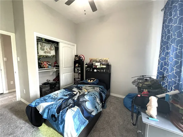 a bedroom with bed and a window