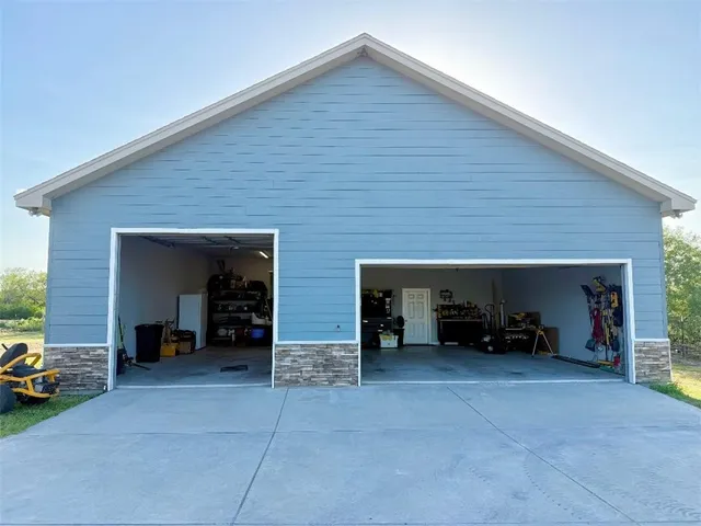 a view of a livingroom with furniture and a car