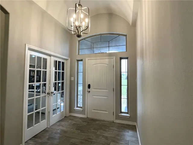a view of a hallway with entryway