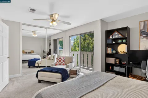 a bedroom with bed and a window