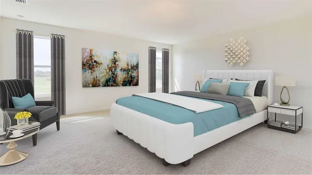 a spacious bedroom with a bed and a couch