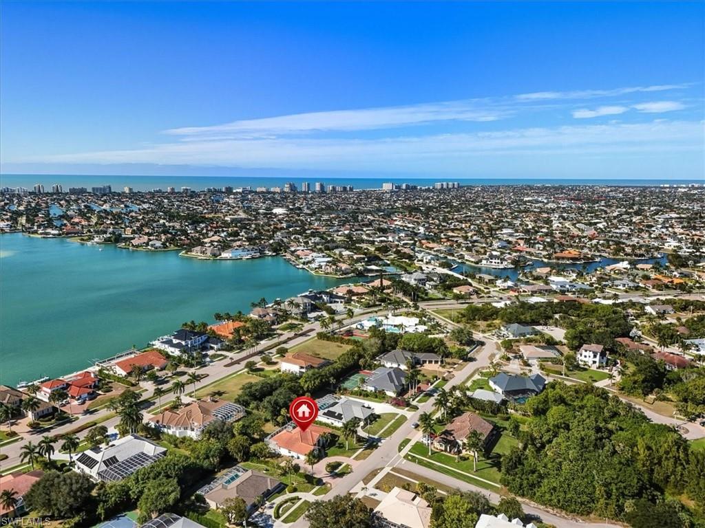 560 Inlet Drive Marco Island, FL 34145 - Photo 28 of 32 Roberts Bay and Gulf - Aerial overview of property's location featuring nearby suburban area and a nearby body of water