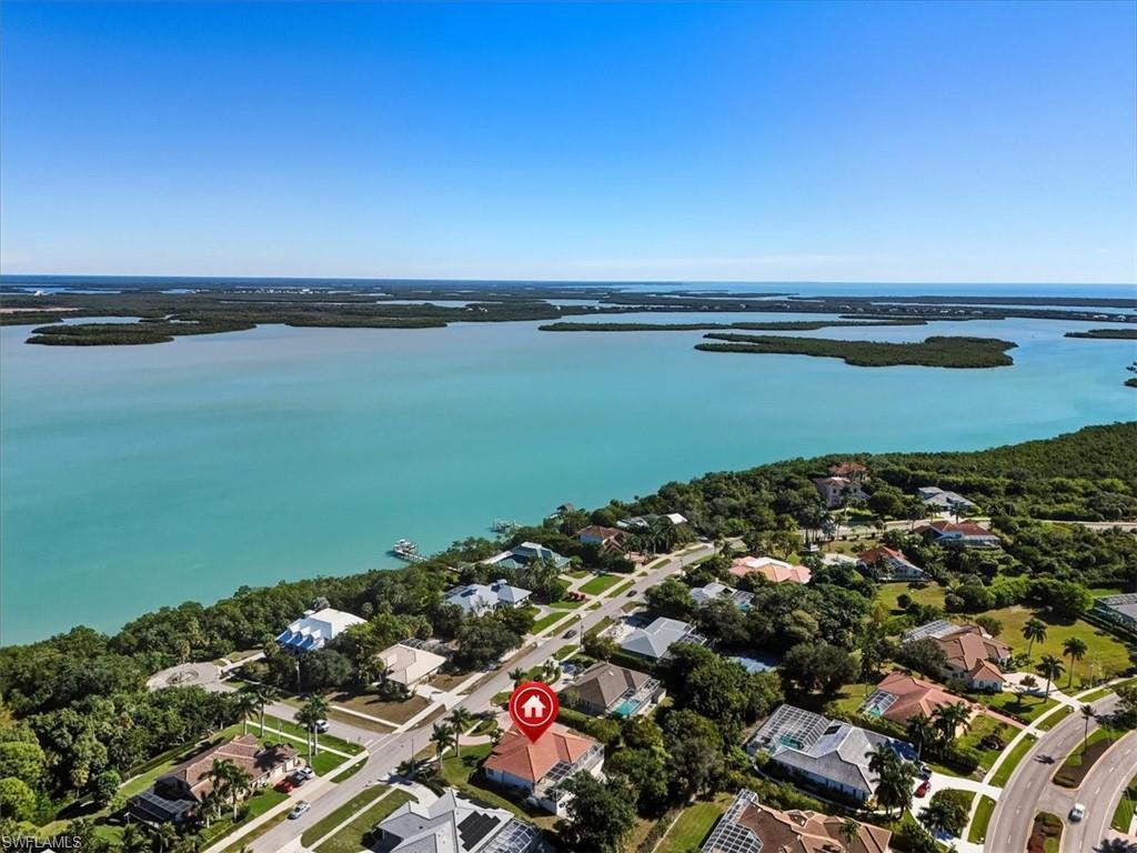 560 Inlet Drive Marco Island, FL 34145 - Photo 29 of 32 Barfield Bay - Aerial view of property and surrounding area with nearby suburban area and a large body of water