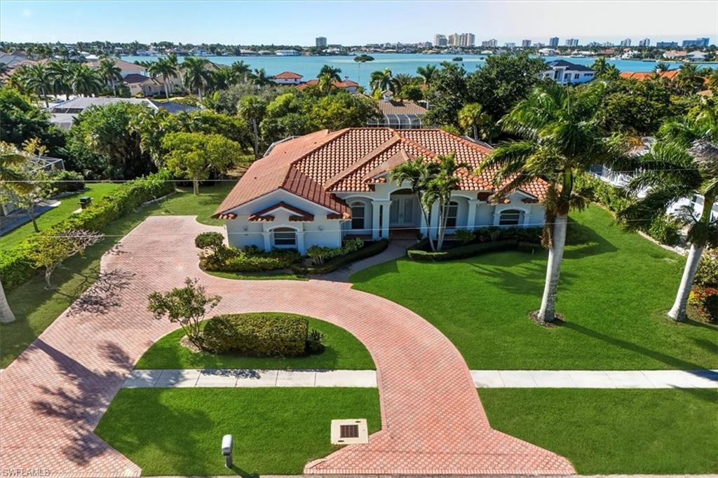 560 Inlet Drive Marco Island, FL 34145 - Photo 3 of 32 View of urban area with a nearby body of water