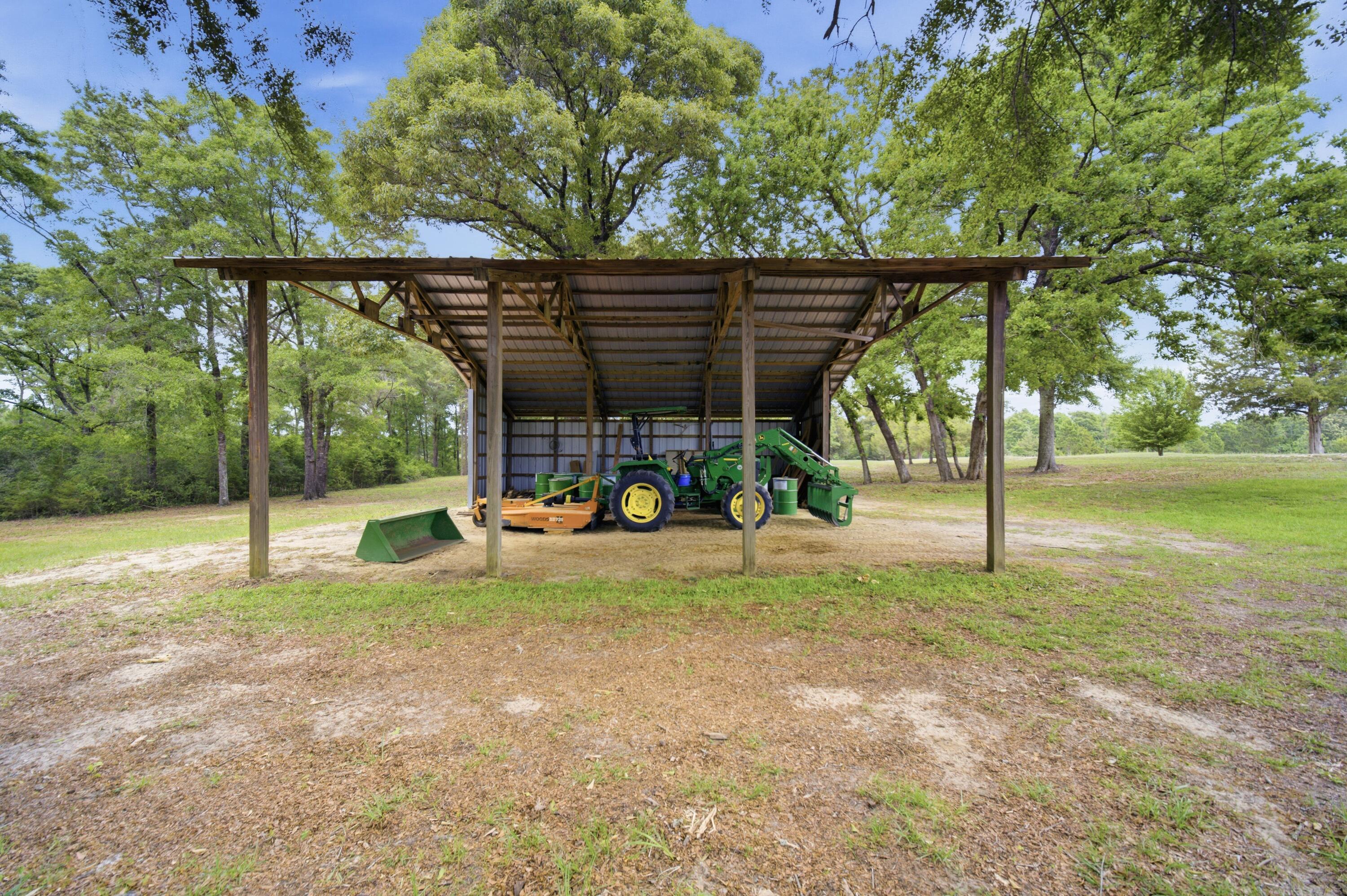 261 Wilkerson Road DeFuniak Springs, FL 32433 - Photo 72 of 76 a view of a park with a slide