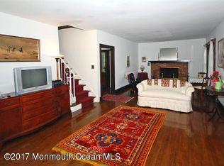 1122 Springfield Avenue New Providence, NJ 07974 - Photo 14 of 28 a living room with furniture and a fireplace