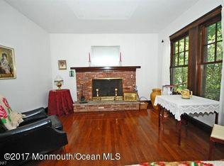 1122 Springfield Avenue New Providence, NJ 07974 - Photo 15 of 28 a living room with furniture and a fireplace