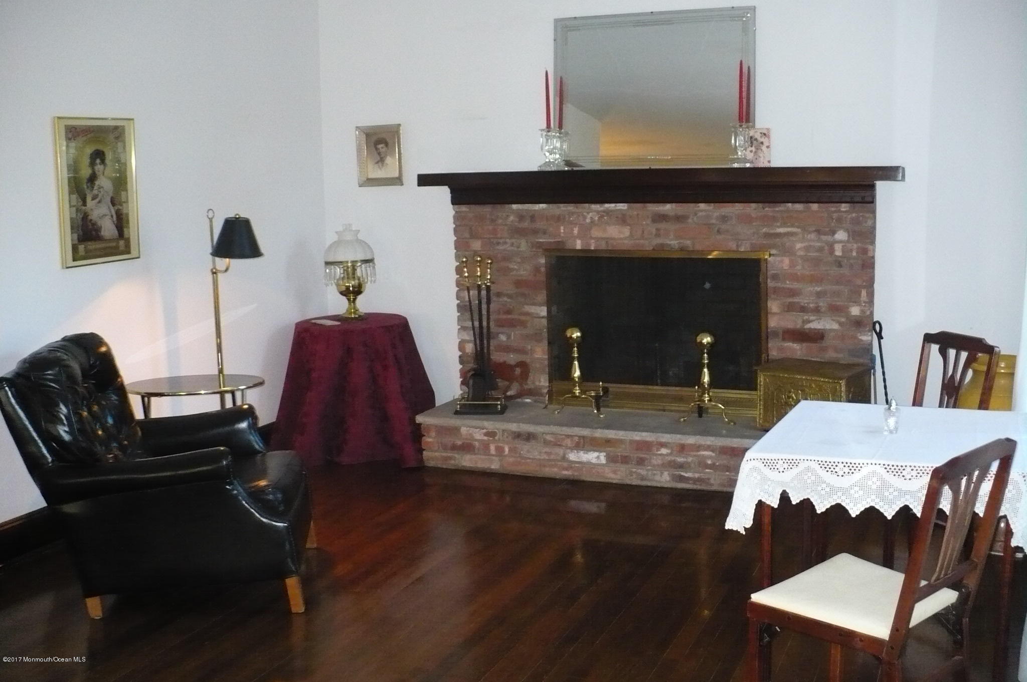 1122 Springfield Avenue New Providence, NJ 07974 - Photo 16 of 28 a living room with furniture and a fireplace