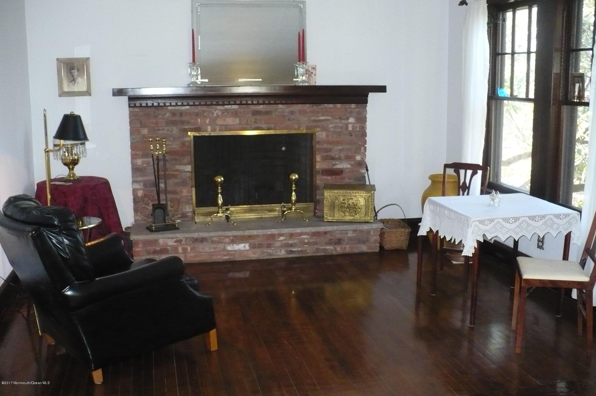 1122 Springfield Avenue New Providence, NJ 07974 - Photo 18 of 28 a living room with furniture and a fireplace
